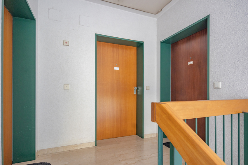 Kolping_Eingangstuer Dachgeschosswohnung Dachau